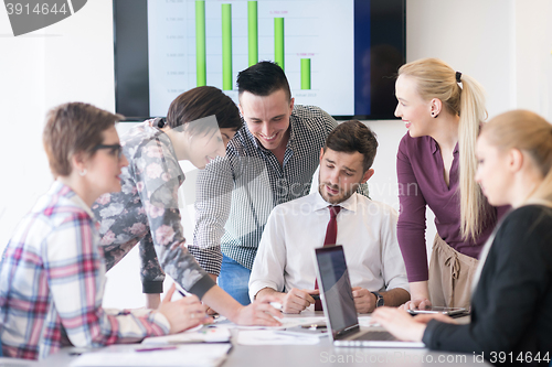 Image of young business people group on meeting at modern office