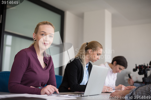 Image of young business people group on team meeting at modern office