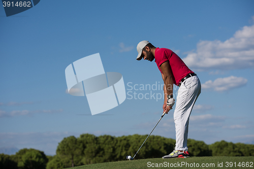 Image of golf player hitting long shot