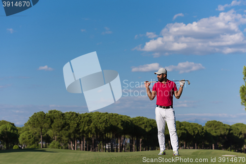 Image of handsome middle eastern golf player portrait at course