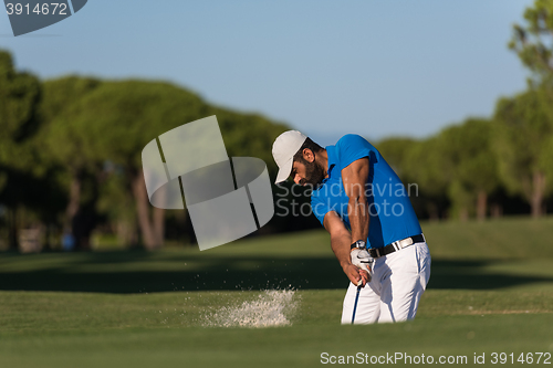 Image of pro golfer hitting a sand bunker shot