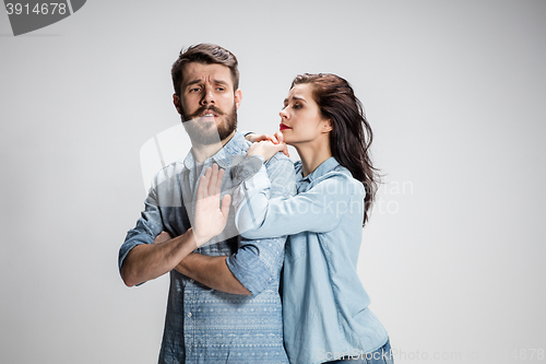 Image of The young couple with different emotions during conflict
