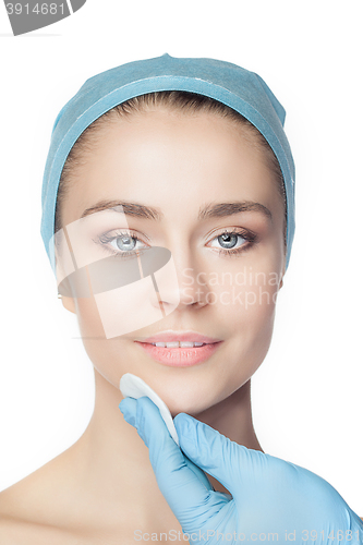 Image of Attractive woman at plastic surgery with syringe in her face