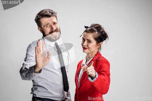 Image of The business man and woman communicating on a gray background