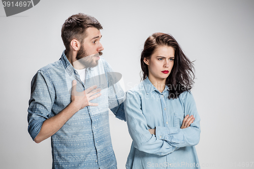 Image of The young couple with different emotions during conflict