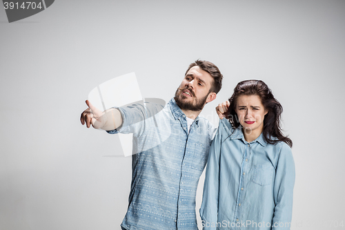 Image of The young couple with different emotions during conflict