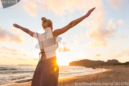 Image of Free Happy Woman Enjoying Sunset on Sandy Beach