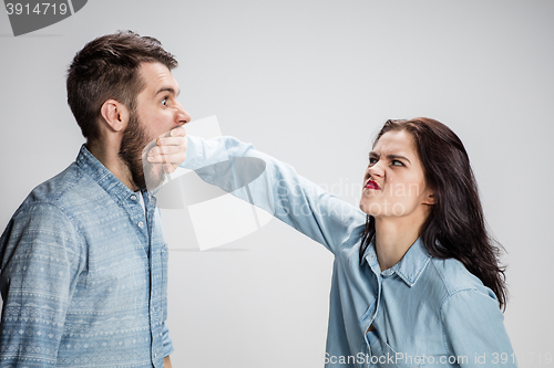 Image of The young couple with different emotions during conflict