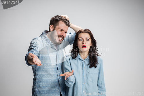 Image of The young couple with different emotions during conflict