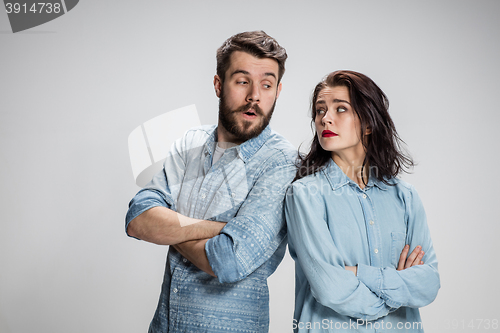 Image of The young couple with different emotions during conflict