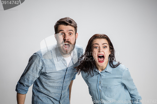 Image of The screaming man and woman on gray