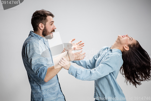 Image of Portrait of happy couple on gray background