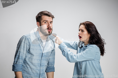 Image of The young couple with different emotions during conflict