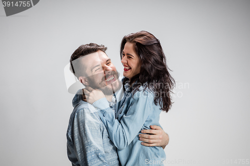 Image of Portrait of happy couple on gray background