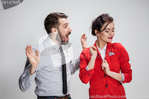 Image of The business man and woman communicating on a gray background