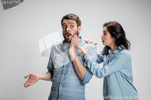 Image of Portrait of happy couple on gray background