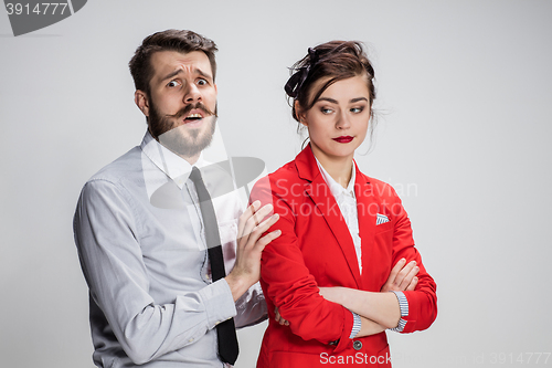 Image of The business man and woman communicating on a gray background