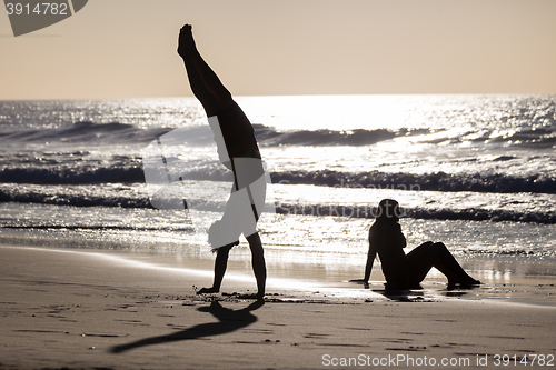 Image of Happy couple having fun on beach.