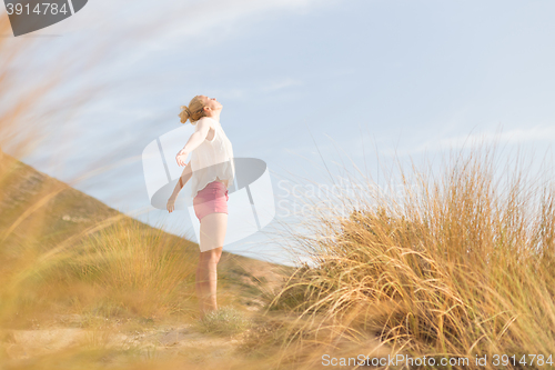 Image of Free Happy Woman Enjoying Sun on Vacations.