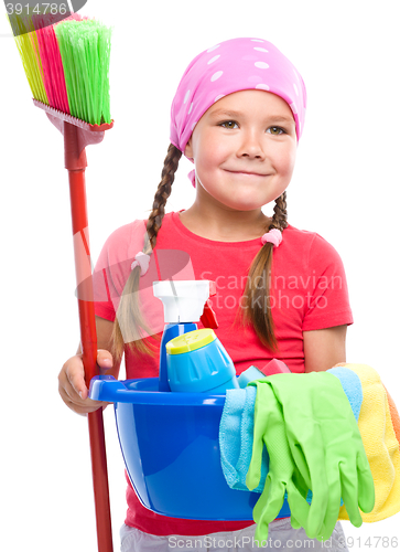 Image of Young girl is dressed as a cleaning maid