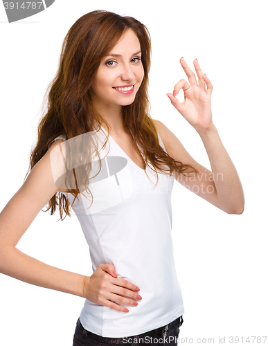 Image of Woman is showing OK sign