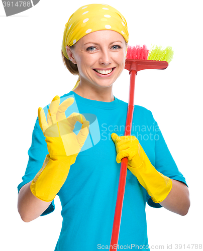 Image of Young woman as a cleaning maid