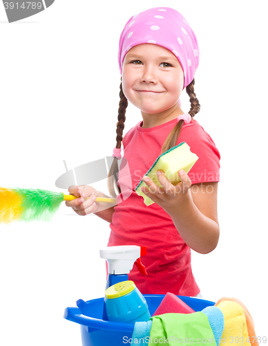 Image of Young girl is dressed as a cleaning maid