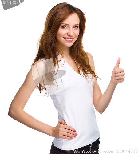 Image of Woman is showing thumb up gesture