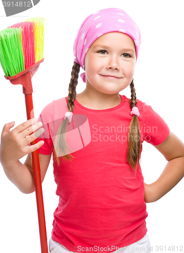 Image of Young girl is dressed as a cleaning maid