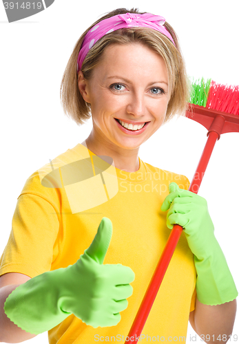 Image of Young woman as a cleaning maid