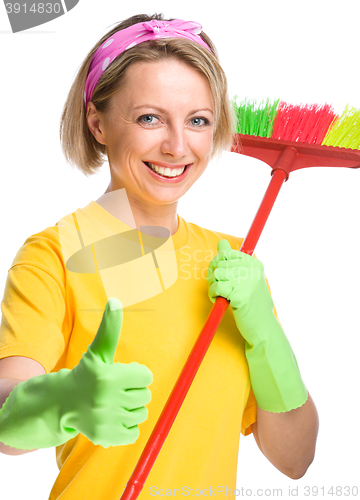 Image of Young woman as a cleaning maid