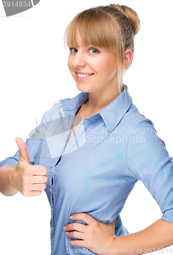 Image of Woman is showing thumb up gesture