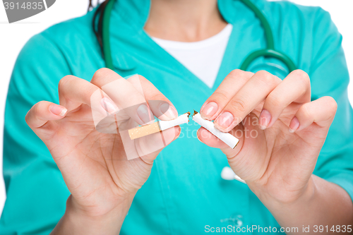 Image of Doctor in uniform breaks cigarette