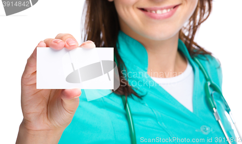 Image of Doctor is showing her business card