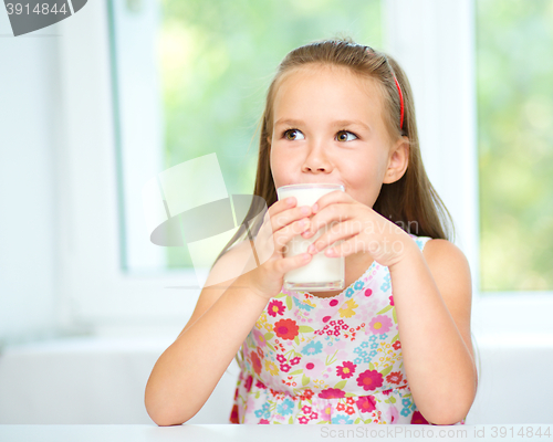 Image of Little girl with a glass of milk