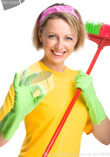 Image of Young woman as a cleaning maid