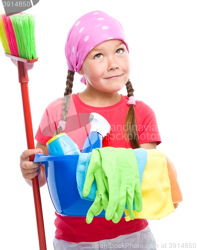 Image of Young girl is dressed as a cleaning maid