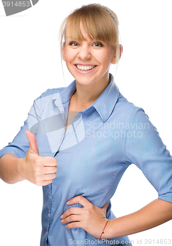 Image of Woman is showing thumb up gesture