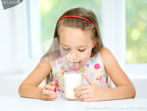 Image of Little girl with a glass of milk