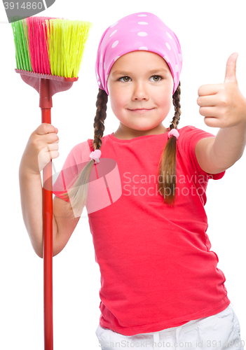 Image of Young girl is dressed as a cleaning maid