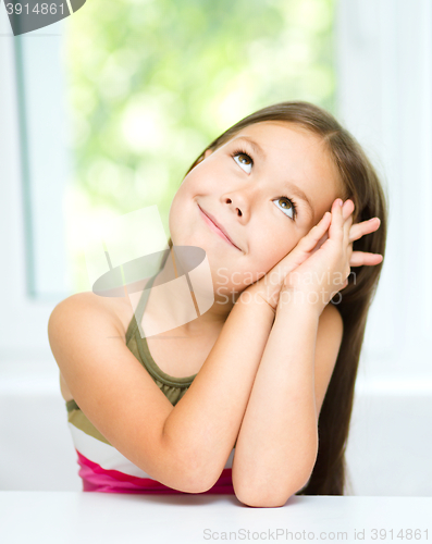 Image of Little girl is daydreaming
