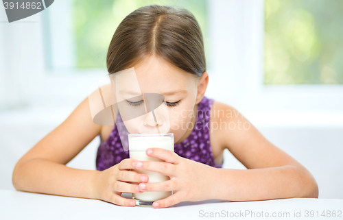 Image of Little girl with a glass of milk