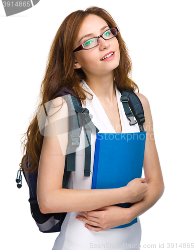 Image of Young student girl is holding book