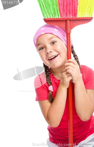 Image of Young girl is dressed as a cleaning maid