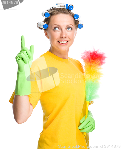 Image of Young woman holding static duster