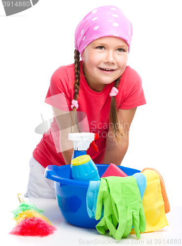 Image of Young girl is dressed as a cleaning maid