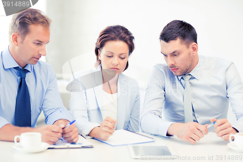 Image of business team discussing something in office