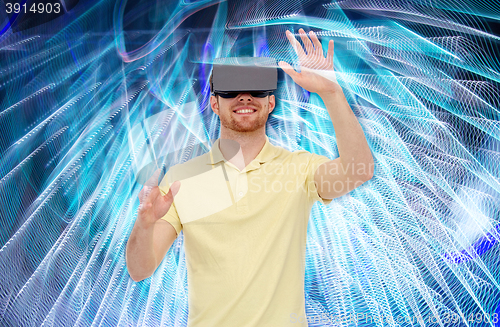 Image of happy man in virtual reality headset or 3d glasses