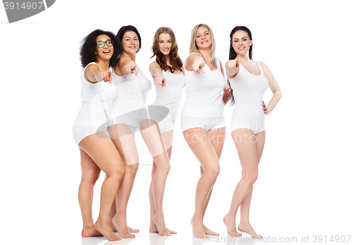 Image of group of happy different women pointing on you