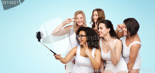 Image of group of happy women taking selfie by smartphoone